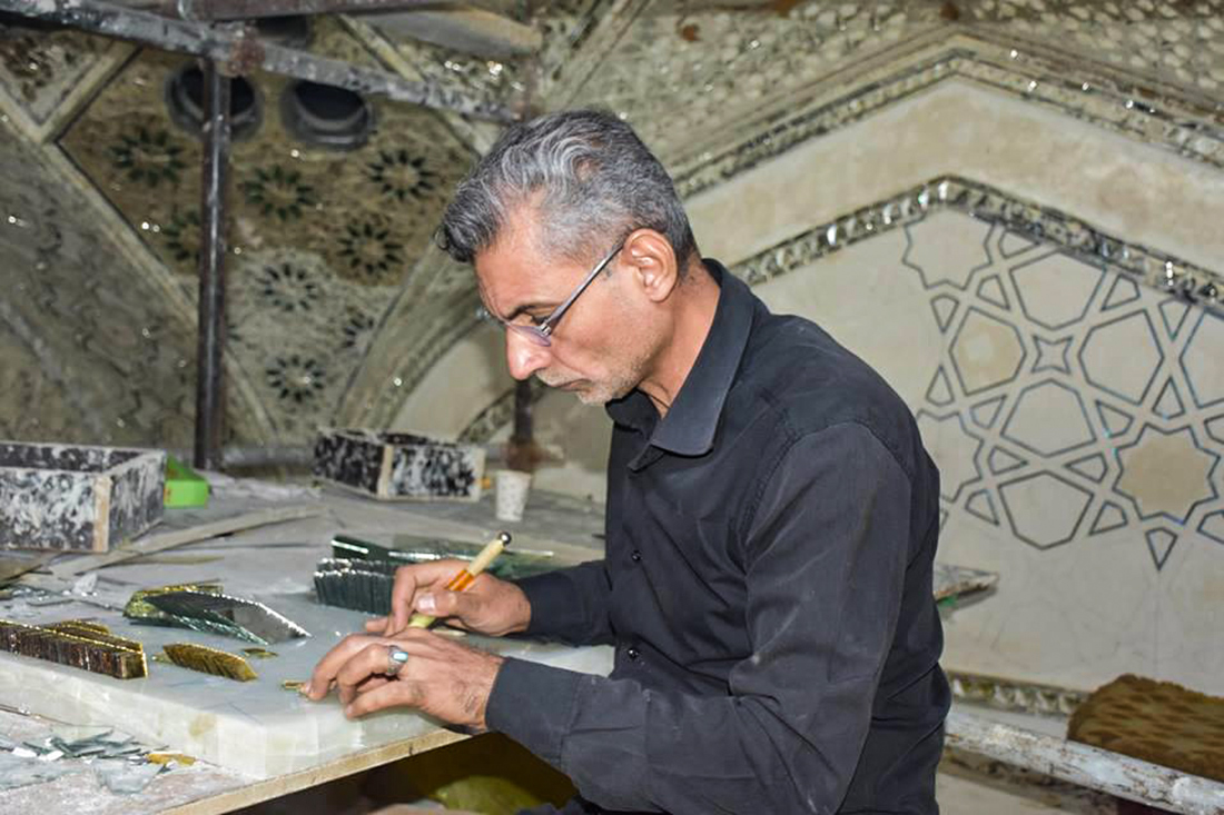 Decorative mirror works achieved next to lattice-enclosed tomb of  Imam Hussain (Peace Be Upon Him)